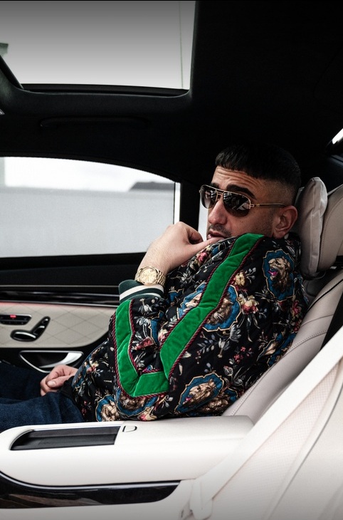 Haftbefehl sitting in a car, Aykut Anhan aka Haftbefehl is a German Rapper